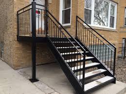 We keep our wrought iron railings at the top. Chicago Iron Railings Handrails Contractors Chicago Fences And Gates Contractors Railings Outdoor Exterior Stairs Outdoor Stair Railing