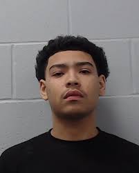 MURDER SUSPECT AT LARGE