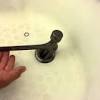 Make sure the spout is pointing straight down into the tub. 1