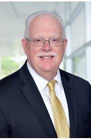 Raymond "Ray" Connolly, Real Estate Agent