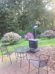 Back Patio With The Outside Wood Stove We Use For Cooking Clams That We Dug Down At Our Private Commu Outside Wood Stove Antique Wood Stove Outdoor Wood Burner