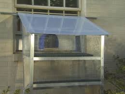 The goal is to provide mental and physical enrichment we have run a tunnel between the sun porch and the screen porch so the cats can enjoy views and smells of the outside. Large Cat House Cat Window Cat Diy Cat Patio