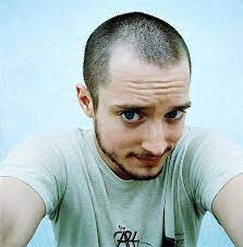 Scalp and face torn off after her hair gets caught in the outboard motor of cody longo's boat, as he's trying to get away from the piranhas. Elijah Wood Photo 6 20