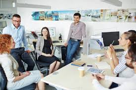 Group of office workers talking at break - Stock Photo - Dissolve