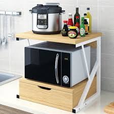 Deze massief houten salontafel van modern earth past helemaal thuis in een landelijk interieur. Meuble A Epices Etagere Pour Micro Ondes Four Hauteur Reglable Etagere De Cuisine Etagere A Epices Rangement 2 Niveaux 03 Blanc Cdiscount Maison