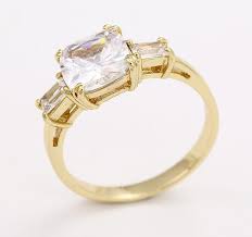 The ring is obviously yellow gold because that's markle's favorite and the main stone itself i sourced from botswana and the little diamonds either side are schwartz also resized and reset meghan's engagement ring. You Can Buy A 40 Replica Of Meghan Markle S Engagement Ring Hellogiggles