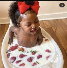If you want to give a bath to your kid, make sure to use lukewarm to warm water. Milk And Strawberry Baby Baby Milk Bath Beautiful Black Babies Baby Girl Pictures