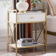 This modern white nightstand features a circular top and gold legs for aesthetic effect. Brayden Studio Emmeloord Metal 1 Drawer Nightstand Metal Nightstand Bedroom Night Stands Modern Side Table Bedroom
