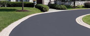 Installation of a base layer of asphalt. Driveway Cost Richfield Blacktop