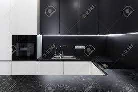Reviewing kitchen pictures and photos are a great way to get a feel for different kitchen layouts and help you decide what you want. Photo Of Elegance Interior In New Hotel Apartment Modern Black Stock Photo Picture And Royalty Free Image Image 114929690