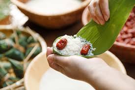 Glutinous rice wrapped in bamboo leaves with a variety of fillings (here's a cool video on how to cook them). Fete Dragon Boat Festival With Zongzis And A Slice Of History Cgtn