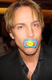 Silly Saturday photo -- Larry Birkhead tests pacifier
