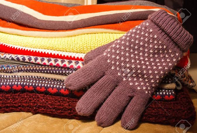 Image result for pile of warm clothes"