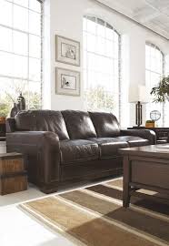 Crestwood Walnut Sofa See More At Facebook Com Ashleyfurniturehomstoreca Furniture Ashley Furniture Furniture Homestore