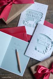 Diy christmas cards are a great way to send a thoughtful note during the holidays. Elegant Paper Cut Christmas Cards Lia Griffith
