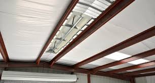 Insulated Roof With Ridge Vent The White Vinyl Backed Metal Building Insulation Helps To Preven Metal Building Insulation Metal Buildings Building Insulation