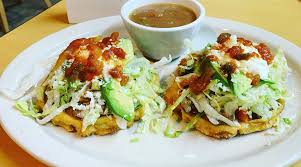 New mexico style red chile cheese enchiladas topped with two eggs, crowned with shredded lettuce, served w/ refried beans and two hot flour tortillas. New Mexican Restaurant Opens In Former Saigon Express North Of Downtown San Antonio Flavor