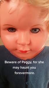Peggy is a haunted doll in the UK that has caused physical harm to those  who have interacted with her. Her owners have warned against taking her  photograph or even speaking her name, as it may invite ...