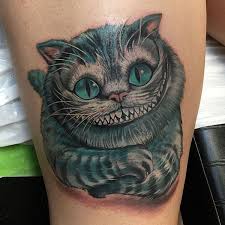 22 Awesome Cheshire Cat Tattoos Catster Cheshire Cat Tattoo Disney Tattoos Cat Tattoo
