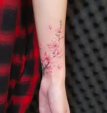 10 Cherry Blossom Branch Tattoo Ideas For Your New Floral Tattoo Design Check Out Our Blog In 2020 Cherry Blossom Tattoo Floral Back Tattoos Wrist Tattoos For Women