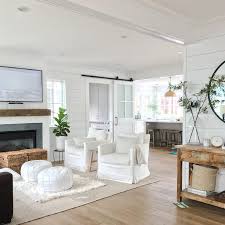They infuse these rooms with softness and style. White Slipcovered Accent Chairs With Beige Rug Transitional Living Room