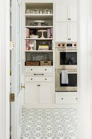 Osborn & little's ponti wallpaper provides a shimmering backdrop inside cubbies storing shoes and bags. 9 Rachel Parcell S Pantry Ideas Parcell Interior Design Pantry Design