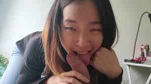 Cute asian babe sucks her BFs white cock and takes a facial POV