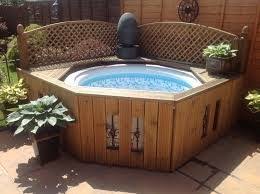 Relaxing in a hot tub is one of the best ways to get rid of stress and tensions of the day. Image Associee Hot Tub Surround Hot Tub Patio Hot Tub Backyard