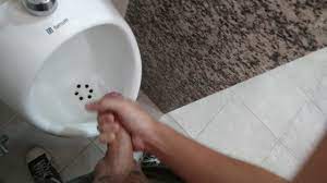 Cumming in urinal