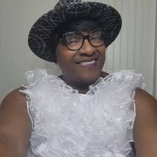 Mean. Green. Smiling.