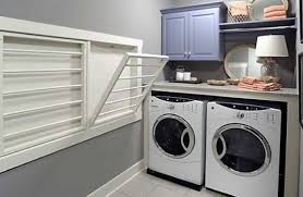 Shelves stretch over the washer and dryer and there's enough space beside them to tuck a bin for sorting. 50 Inspiring Laundry Room Design Ideas