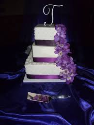 Tropical style wedding cake decorated with purple and orange wedding flowers. Regency Purple Wedding Cake Purple Wedding Cake Purple Wedding Purple Wedding Cakes