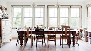 An Eclectic Mix Of Wood Dining Chairs With A Farm Table In This Country Style Dining Room Mismatched Dining Chairs Farmhouse Dining Farmhouse Dining Room