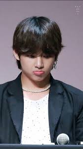 Beautiful happy woman showing love sign near eyes. Bts Wallpapers Cute Taehyung Wallpapers