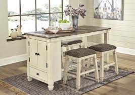 An antique white finish combined with classic architectural details gives the pieces available from this bolanburg bedroom collection a fresh look for your home. Bolanburg Antique White Rectangular Dining Table W 4 Upholstered Stools Furniture Merchandise Outlet