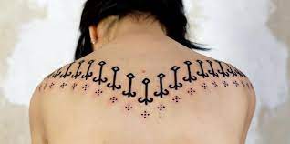 The colors are the best part of this tattoo. 19 Stealthy But Stunning Back Tattoo Designs Inside Out