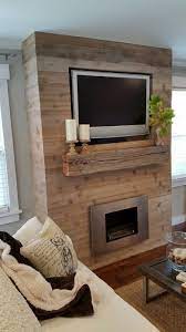 I finished the bottom sections off myself at a safe distance from the ground. Diy Fireplace Feature Wall On A Budget Fireplace Feature Wall Simple Fireplace Home Fireplace