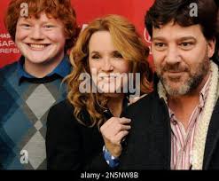 Left to right, Andy Riddle, Lea Thompson and Robert Longstreet, cast  members in "Ping Pong Summer," pose together at the premiere of the film at  the 2014 Sundance Film Festival