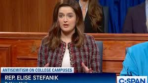 SNL': Chloe Troast's Elise Stefanik Hogs the Mic as 'the Hanukkah Gift No  One Wanted' in Cold Open Roast of GOP Antisemitism Hearings | Video