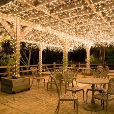 Hang White Icicle Lights To Create Magical Outdoor Lighting This Idea Works Well For Decks Patio Lights And Cover Backyard Solar Powered Fairy Lights Pergola