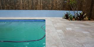 Learn why travertine swimming pool pavers are the best solution for your outdoor area. Read This Before Installing Travertine Pavers Around Pools By Armstone