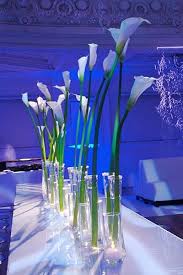 However there are ways to still create stunning a classic centerpiece with calla lillies is to use a very tall vase and then have the calla lillies looking tall and glamorous. Pin On Wedding Centerpieces