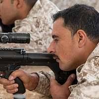 Reserve Component Engineman 2nd Class Manuela Adame fires the M2HB  .50-caliber machine gun aboard USNS Yukon (T-AO-202).