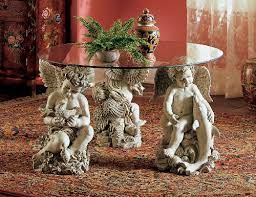Outstanding flame mahogany banded small size drop leaf table 1930s. Glass Topped Cherub Table To Grace Your Home Designbuzz