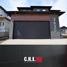 black skyline flush garage door on contemporary home grey black warm wood exterior garage doors contemporary garage doors modern garage doors