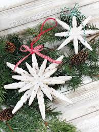 This snowflake wreath looks great in a monochromatic white color scheme or full of color. Clothespin Snowflake Ornaments Crafty Morning