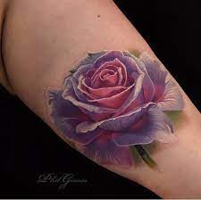 The system utilized by tattooist is making a fantasy that something is a piece of your skin or fairly sitting over the skin. Rose Tattoo Designs And Ideas With Great Images For 2017 Learn About The Story Of Rose Tats Simple Tattoos For Guys Purple Rose Tattoos Realistic Rose Tattoo