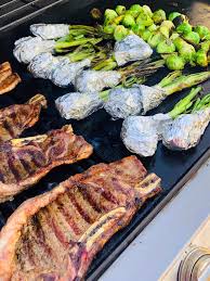 Grill Time Juicy Grilled Steaks Spring Onions With Butter Wrapped In Foils And Brussels Sprouts Drizzled How To Grill Steak Grill Time Brussel Sprouts