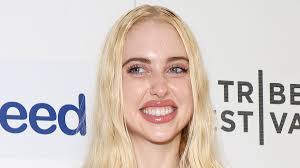 Euphoria star Chloe Cherry is radiant in a stylish white dress while  holding an adorable pup as she attends The French Italian premiere at 2024  Tribeca Film Festival in NYC | Daily