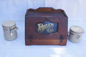 The underside of the lid is a grooved cutting board; Vintage Wooden Bread Box With Matching Sugar Holders Butler County Auction Warehouse Auction Vintage Items Coins Tools Home Goods And More Equip Bid